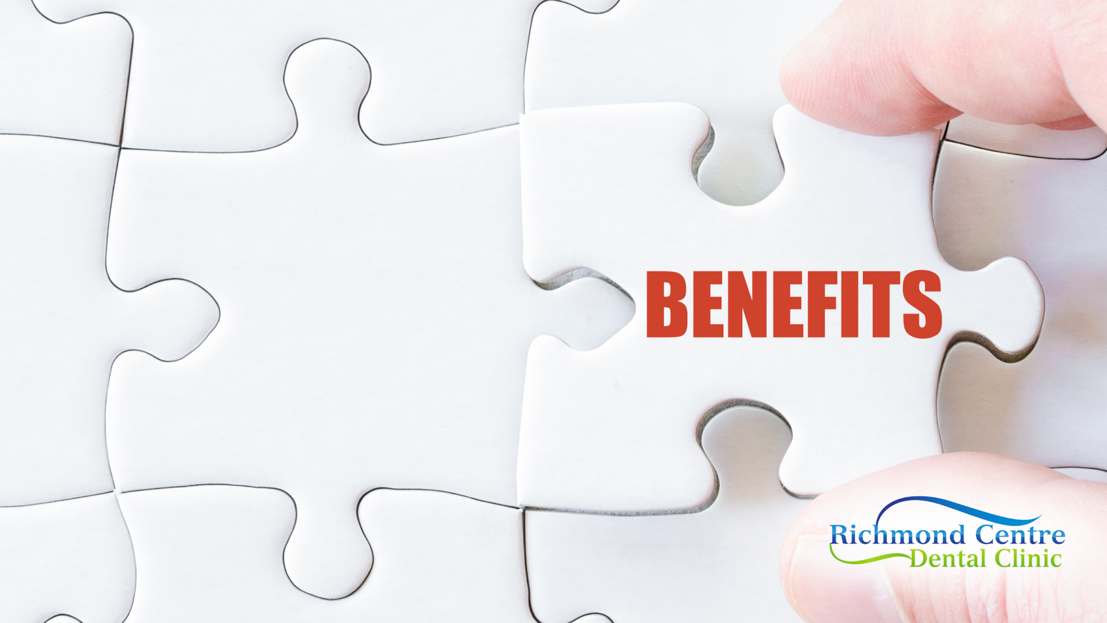 A person is holding a piece of puzzle that says benefits