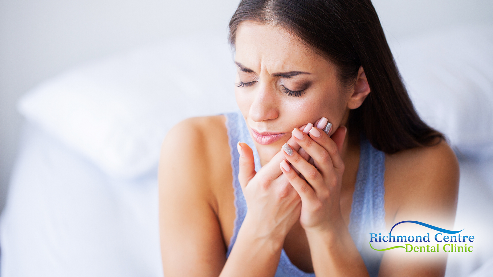 Woman in pain holding her cheek, possibly at home; Richmond Centre Dental Clinic logo.